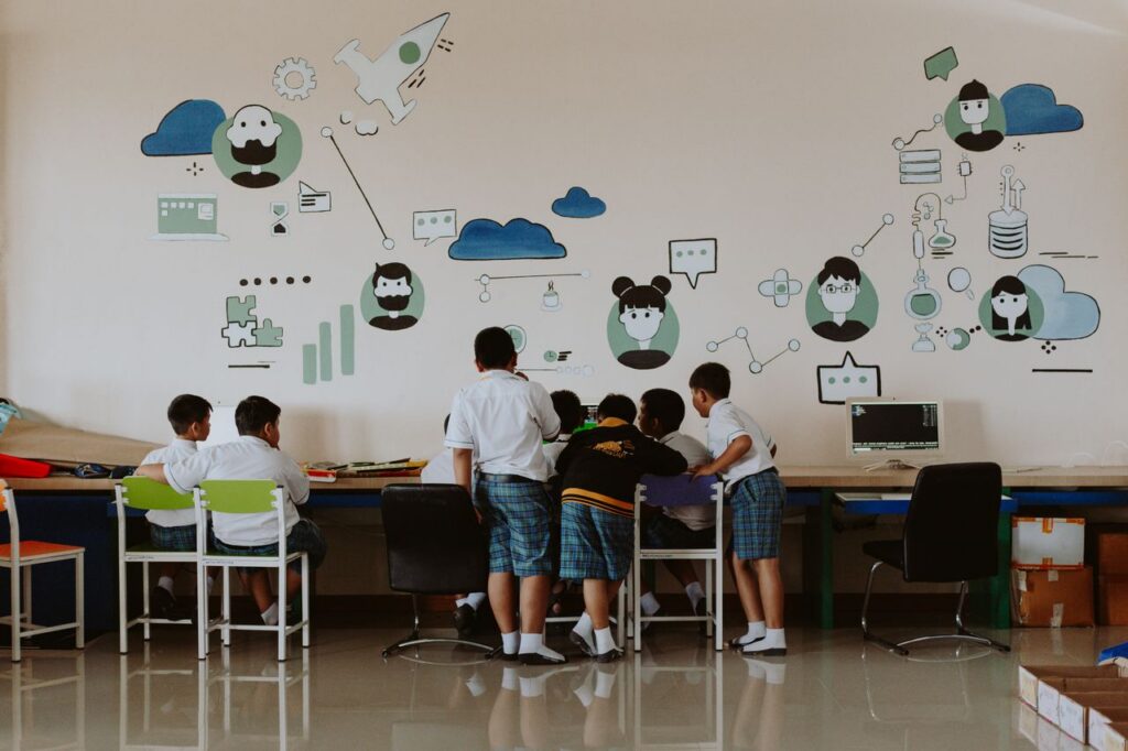 Students exploring technology in a colorful classroom environment, fostering education.